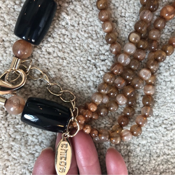 Multi strand necklace of amber colored beads, with navy blue and gold accents - Picture 3 of 4